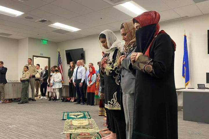 Members of the Muslim community pray inside Metro's Summerlin station on Wednesday, April 27, 2 ...