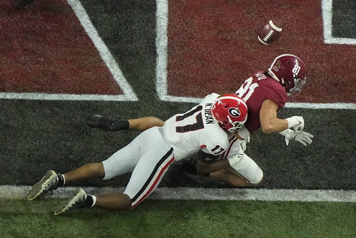 Georgia's Nakobe Dean breaks up a pass intended for Alabama's Cameron Latu during the first hal ...