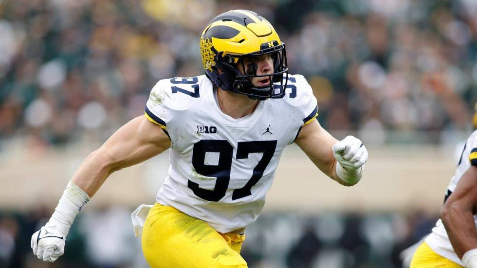 Michigan's Aidan Hutchinson plays during an NCAA college football game against Michigan State o ...