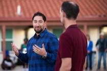 Clark County Commissioners Michael Naft, left, and Justin Jones address attendees during an inf ...