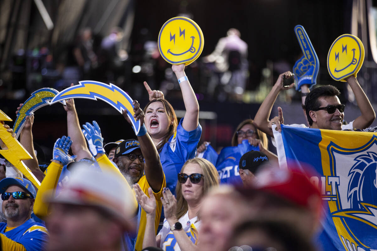 Fans cheer during the round one of the NFL Draft event in Las Vegas, Thursday, April 28, 2022. ...