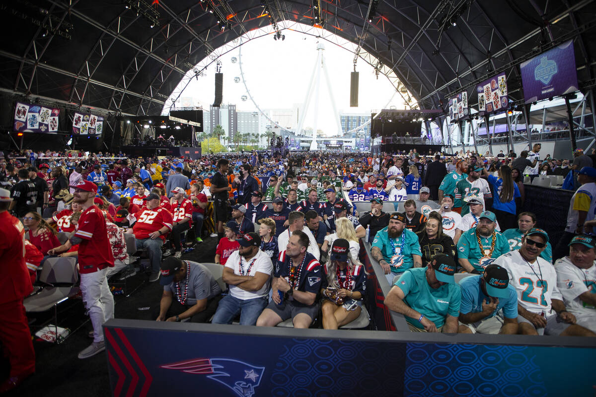 Fans attend the first round of the NFL Draft event in Las Vegas, Thursday, April 28, 2022. (Eri ...