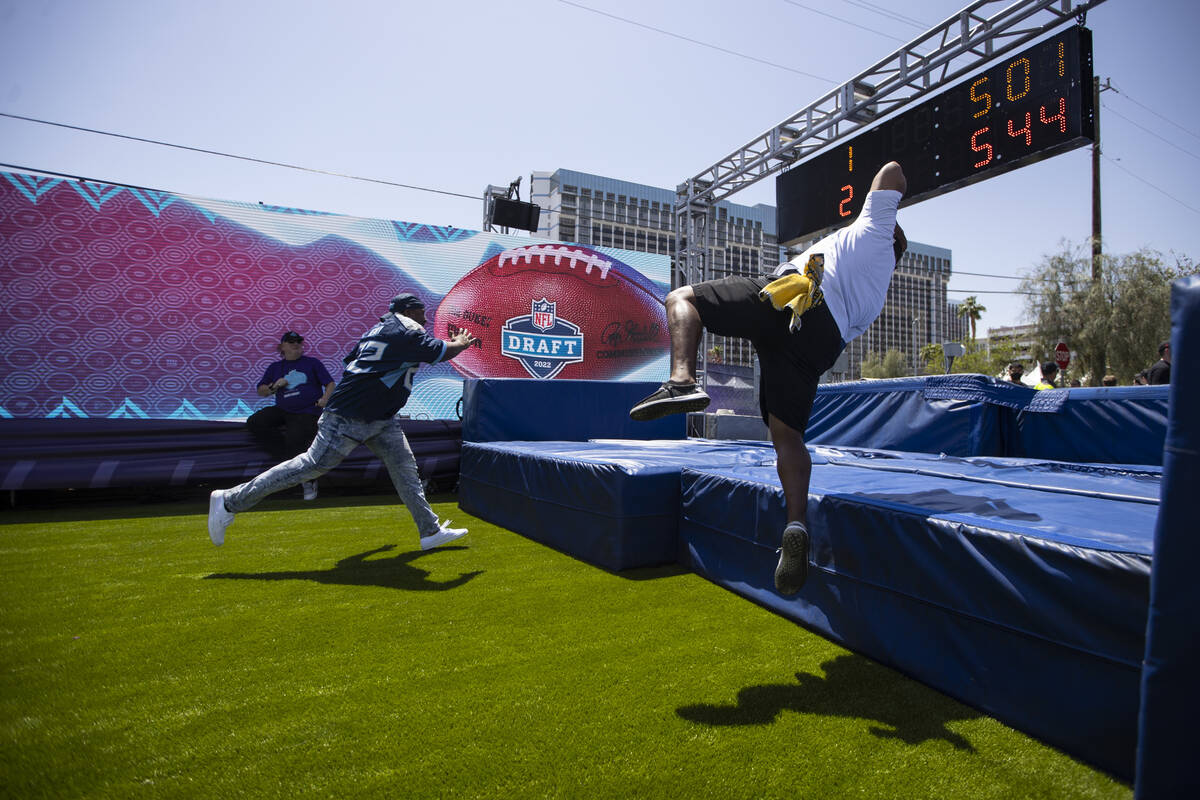 Omar Walton, left, of Houston, and his friend Darryl Dorsey, of Dallas, compete in the 40-yard ...