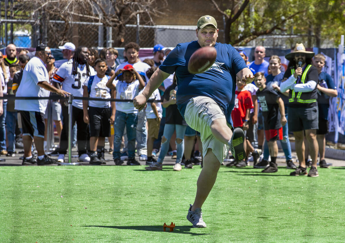 Dallas Cowboys fan Joe Layton of St. George, Utah, kicks a field goal within the Draft Experien ...
