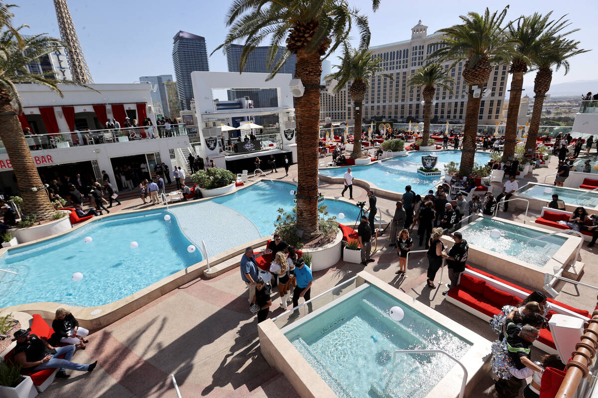 Fans mingle during a watch party at Drai’s Nightclub on the Strip in Las Vegas on Day 1 ...