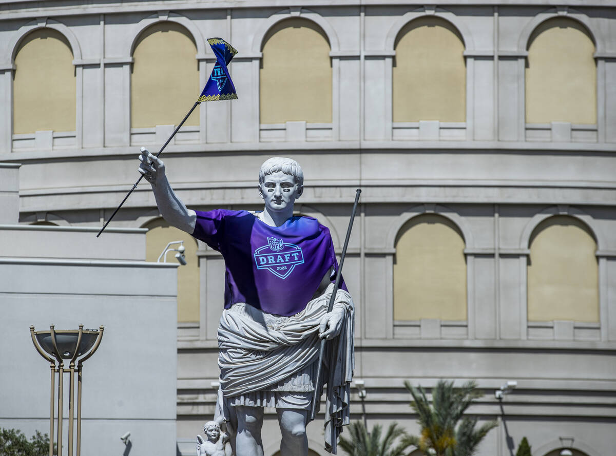The Caesar statue in front of Caesars Palace sports a 2022 NFL Draft jersey on Thursday, April ...