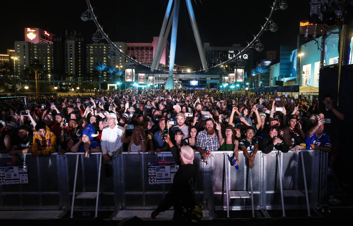 Fans watch as Weezer performs following the first round of the NFL draft on Thursday, April 28, ...