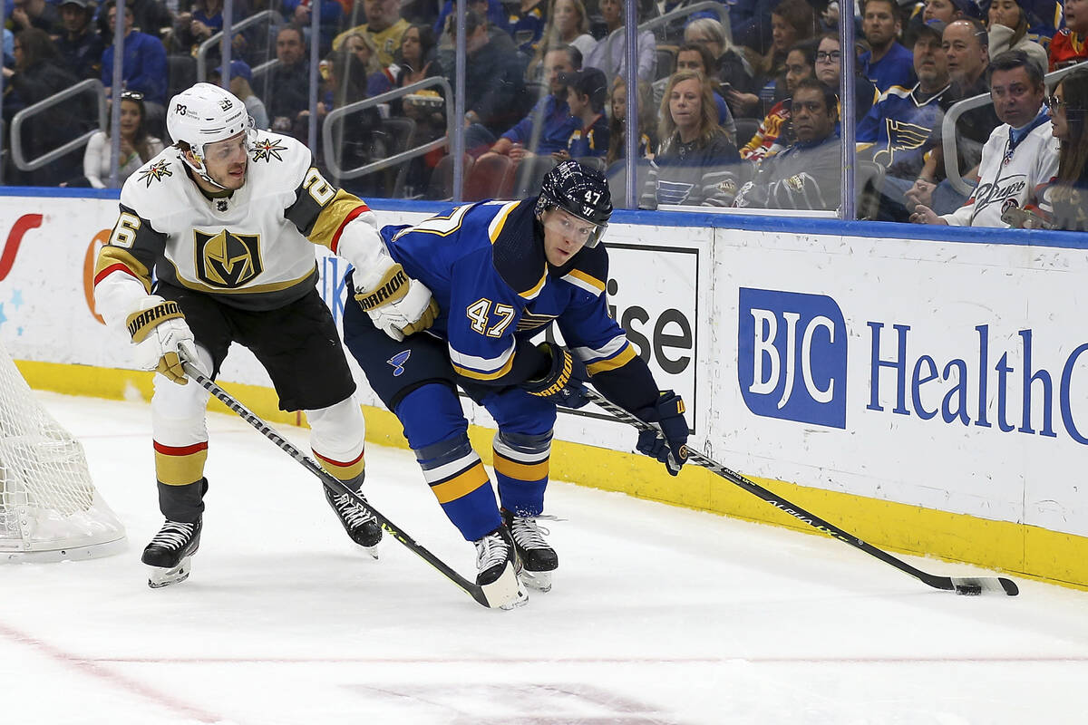 St. Louis Blues' Torey Krug (47) handles the puck while under pressure from Vegas Golden Knight ...