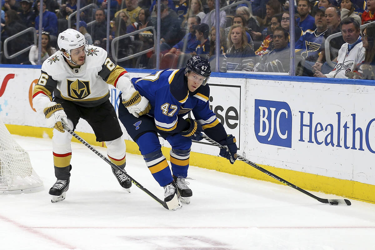 St. Louis Blues' Torey Krug (47) handles the puck while under pressure from Vegas Golden Knight ...