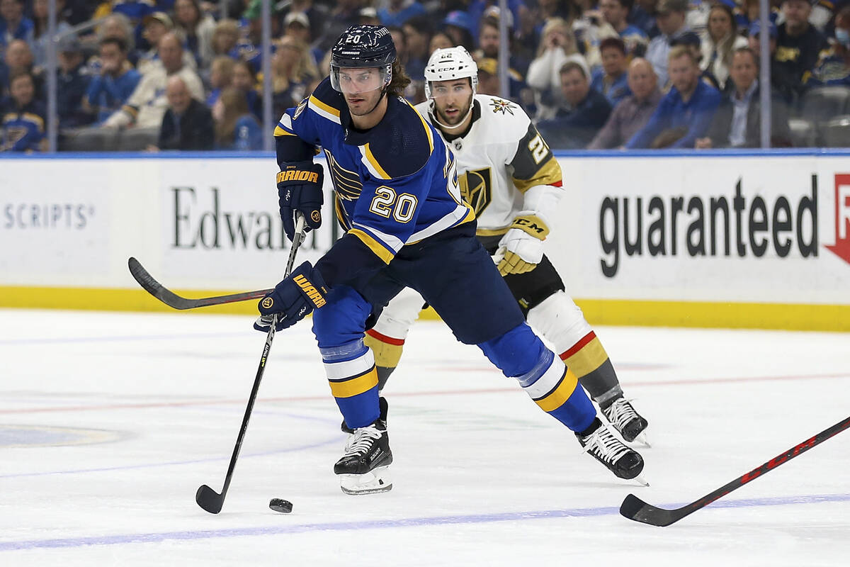 St. Louis Blues' Brandon Saad (20) controls the puck in front of Vegas Golden Knights' Michael ...