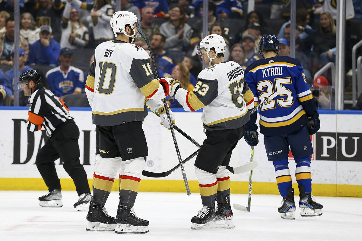 Members of the Vegas Golden Knights celebrate after scoring a goal during the third period of a ...