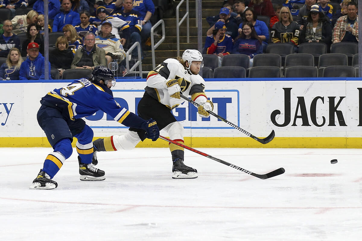 Vegas Golden Knights' William Karlsson (71) shoots the puck and scores a goal while under press ...