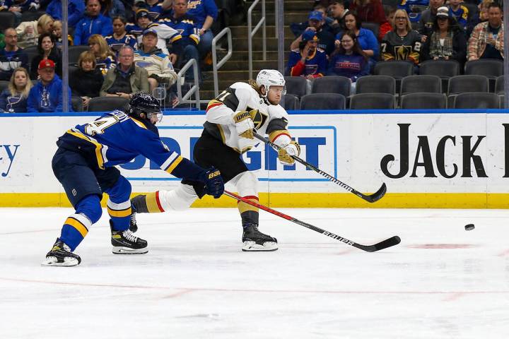 Vegas Golden Knights' William Karlsson (71) shoots the puck and scores a goal while under press ...
