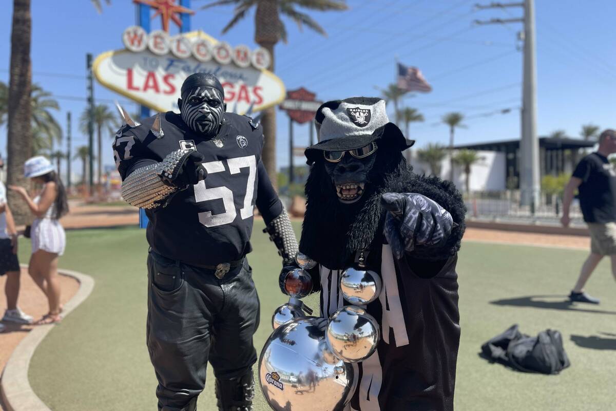Two notable members of the Raiders infamous Black Hole stopped by the Welcome to Las Vegas sign ...