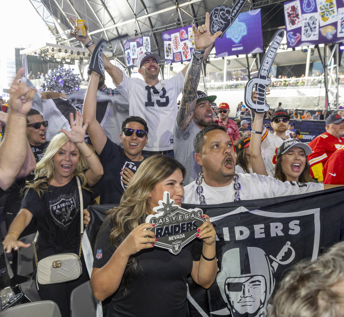 Raiders fans cheer at the Draft Theater during the second day selections for the 2022 NFL draft ...