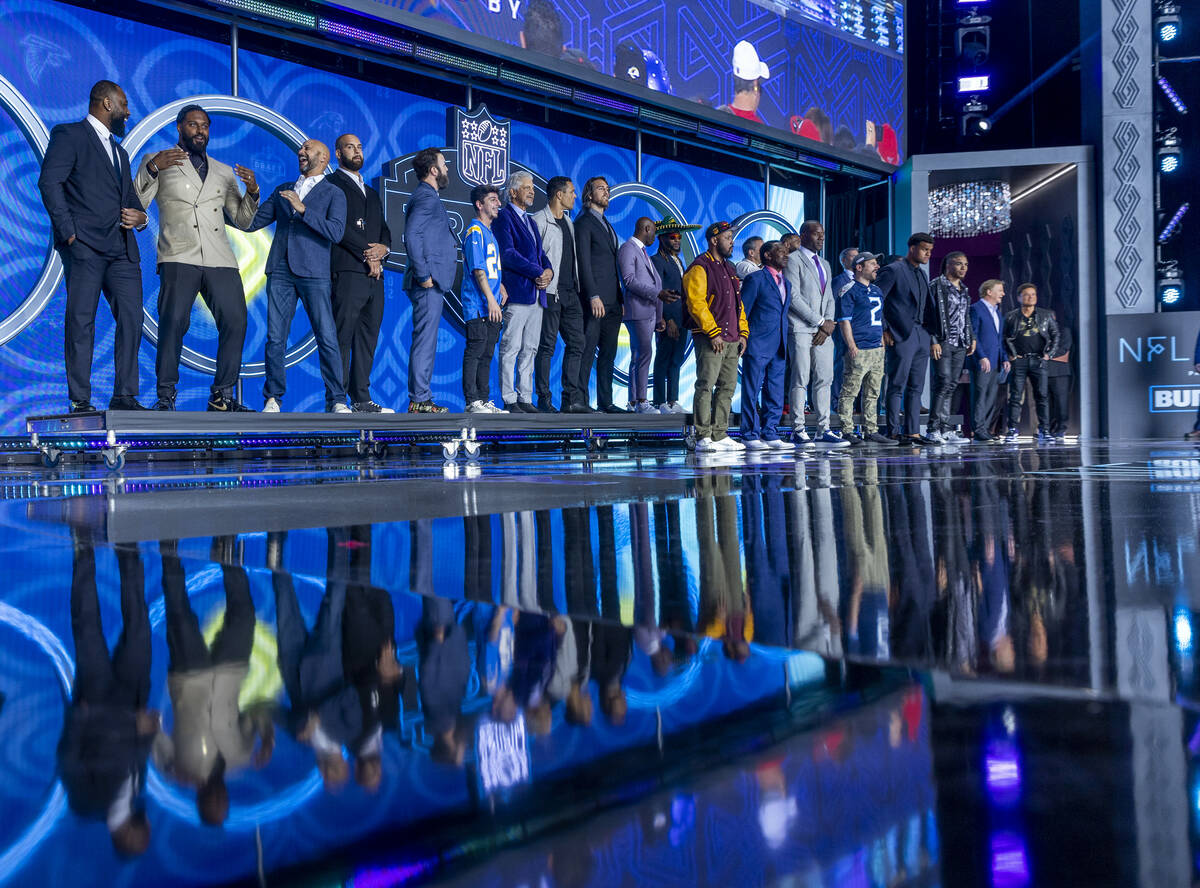 Draft team selection announcers gather on stage at the Draft Theater during the second day sele ...