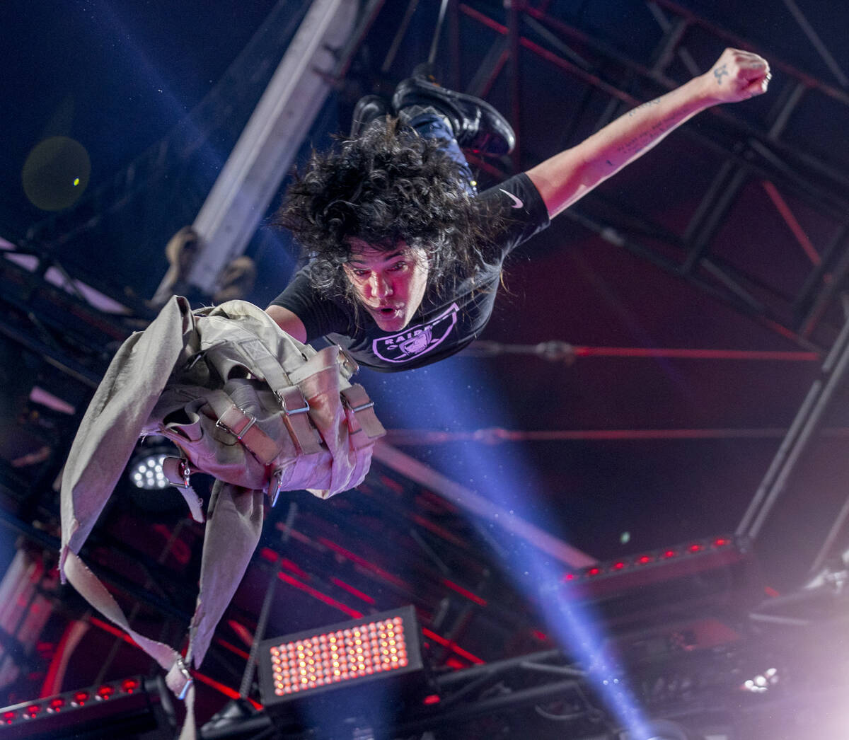 Illusionist Criss Angel hangs upside down after getting out of a straight jacket on the Draft T ...
