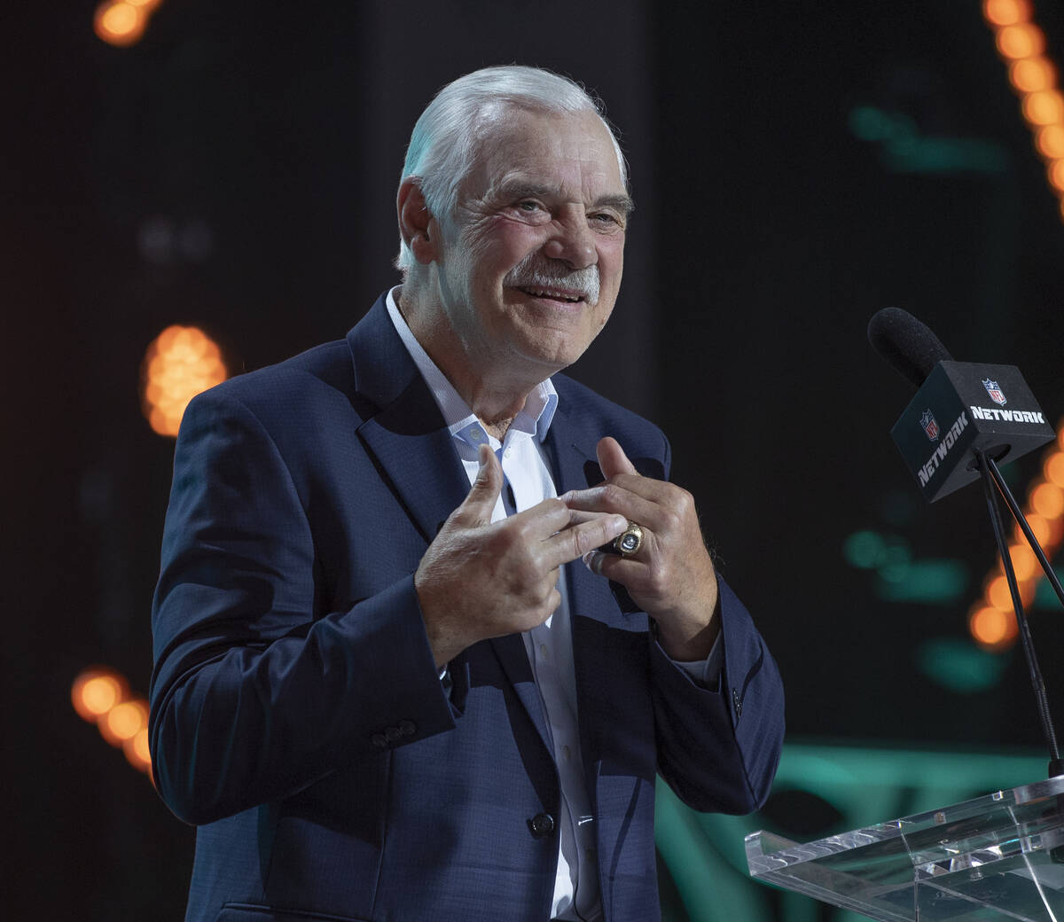 Miami Dolphins great Larry Csonka announces a selection for the team at the Draft Theater durin ...