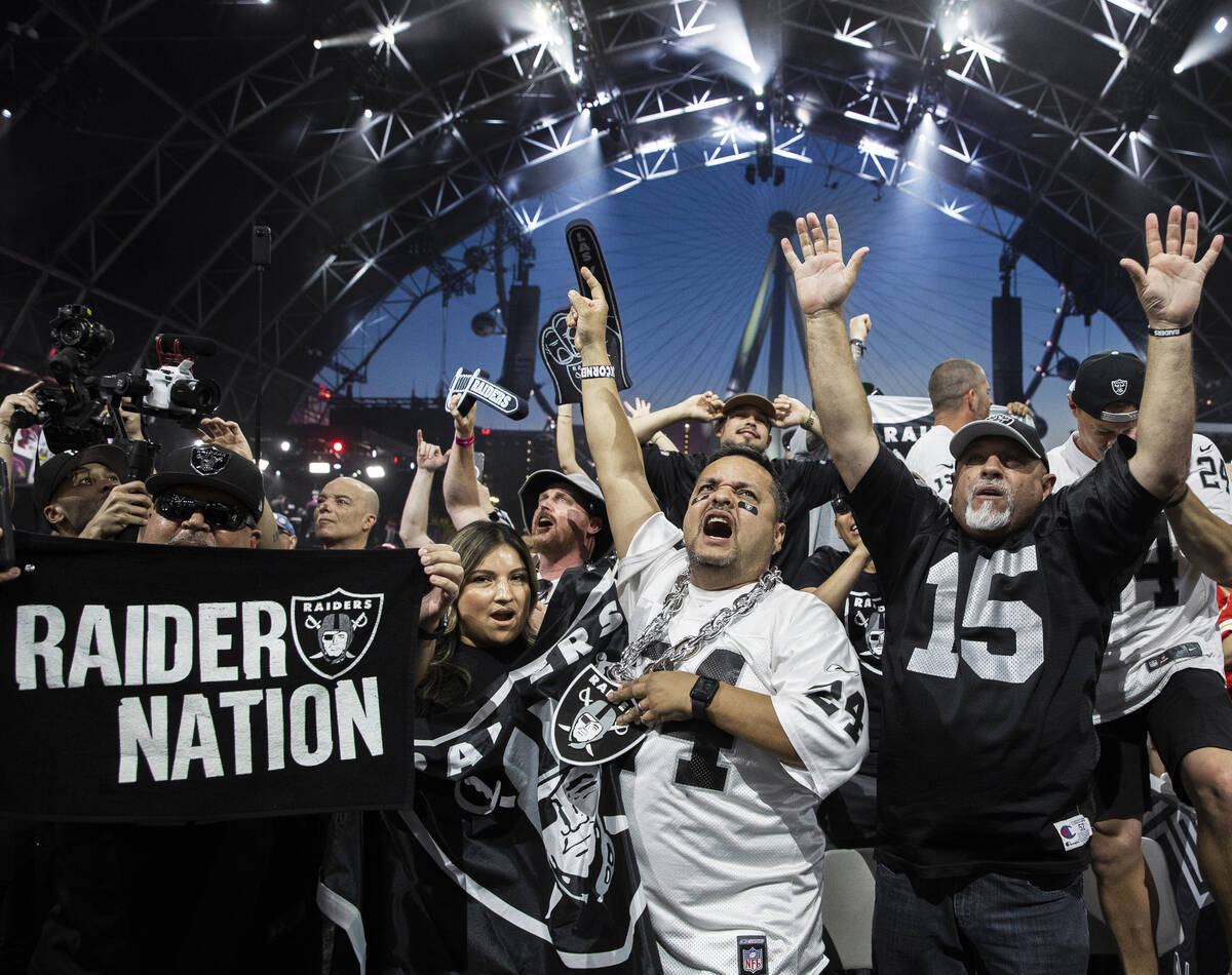 Raiders fans erupt after Las Vegas made their first pick of the 2022 NFL draft on Friday, April ...