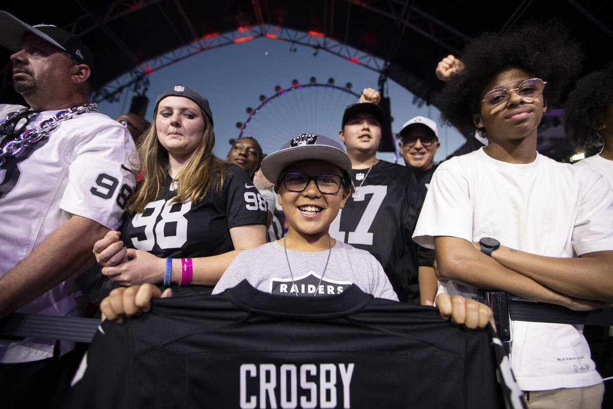 Fans cheer during the Las Vegas Raiders 90th overall pick selection during the second day of th ...