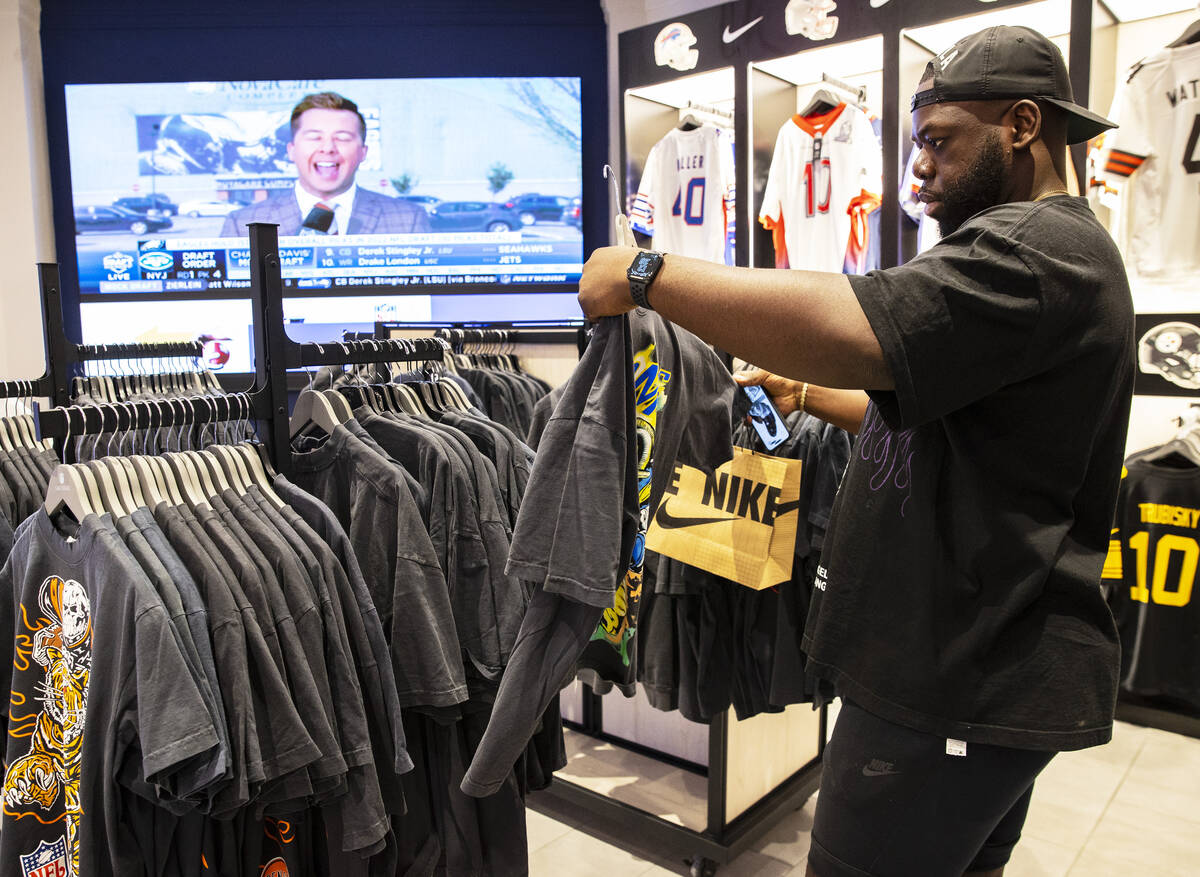 David Ifejika of Toronto, Canada, checks out the Warren Lotas x Mitchell & Ness capsule col ...