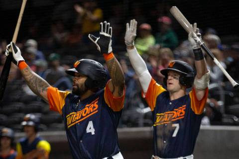 In this April 20, 2022, file photo, Las Vegas Aviators infielders Eric Thames (4) and Marty Bec ...