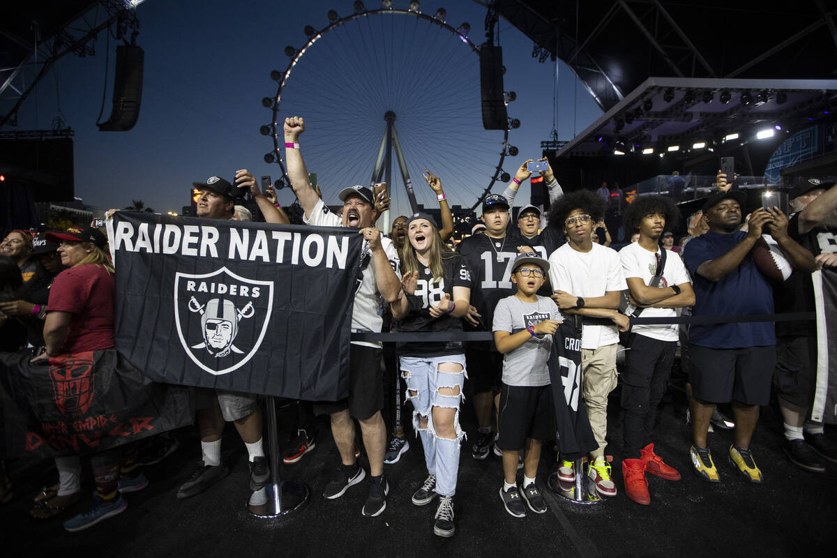Fans cheer during the Las Vegas Raiders 90th overall pick selection during the second day of th ...