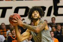 West Virginia forward Isaiah Cottrell (13) looks to the basket during an NCAA college basketbal ...