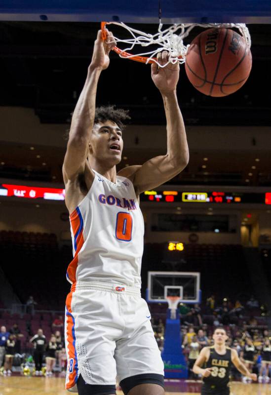 Bishop Gorman junior forward Isaiah Cottrell (0) converts a fast-break dunk in the fourth quart ...