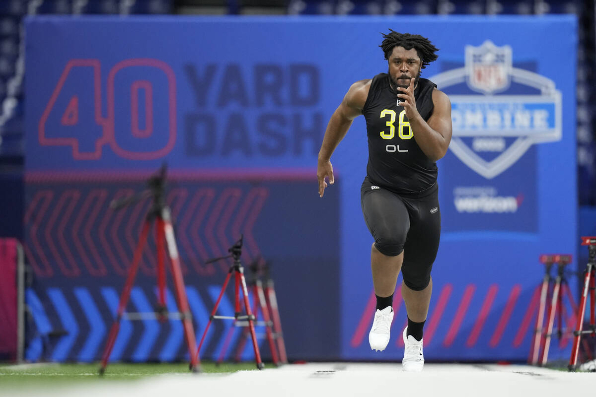Memphis offensive lineman Dylan Parham runs the 40-yard dash at the NFL football scouting combi ...
