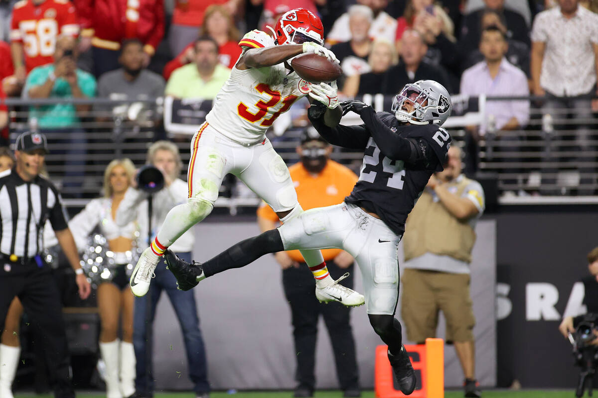 Kansas City Chiefs running back Darrel Williams (31) makes a touchdown catch under pressure fro ...
