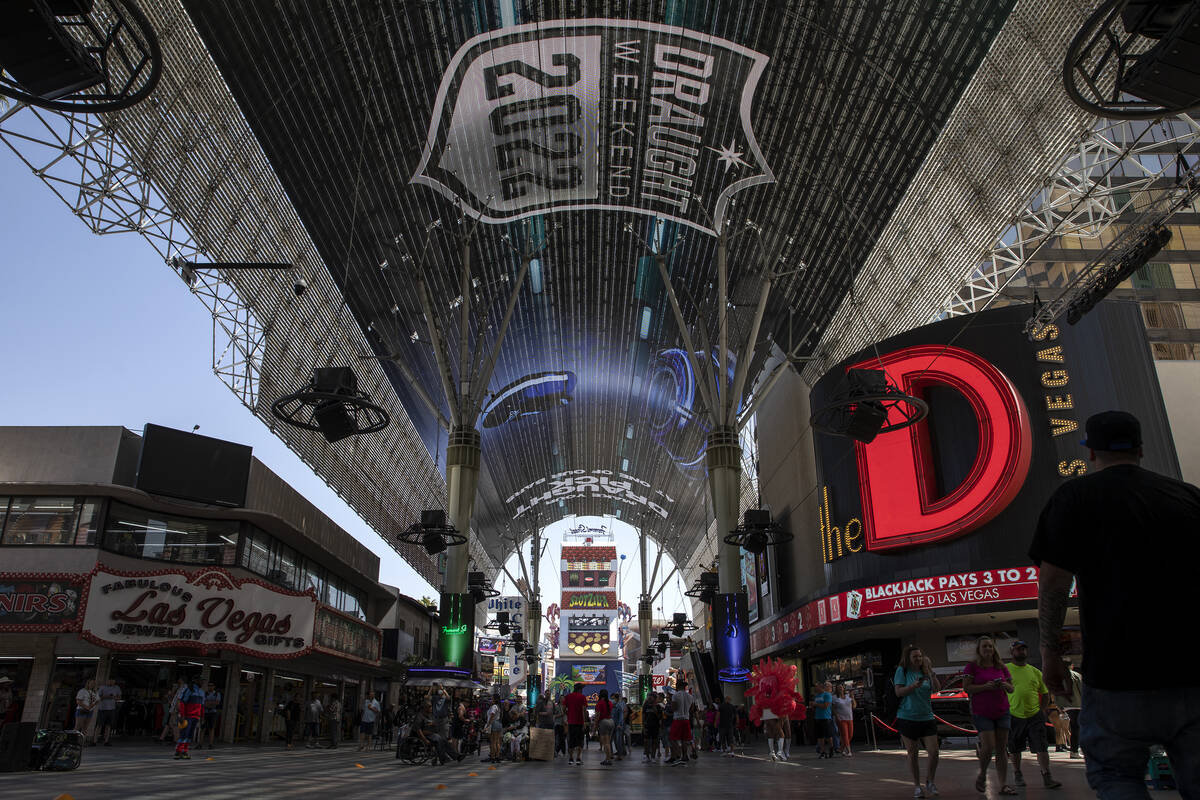 NFL football draft-related messaging is featured on the screen at Fremont Street Experience on ...