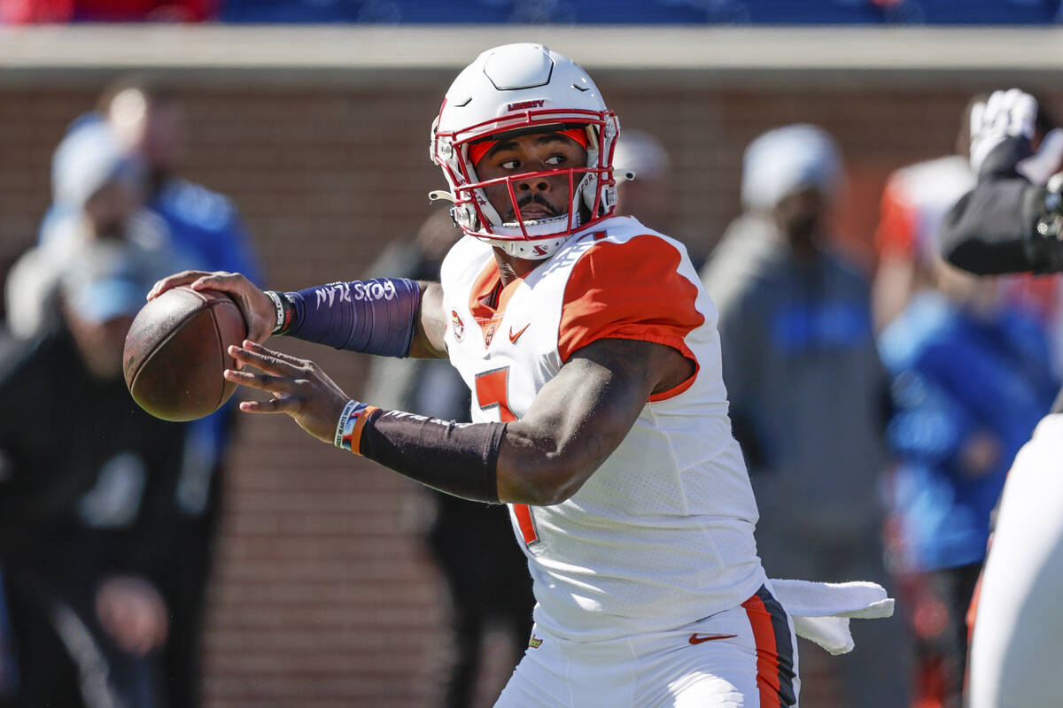 American Team quarterback Malik Willis, of Liberty, throws a pass during the first half of the ...