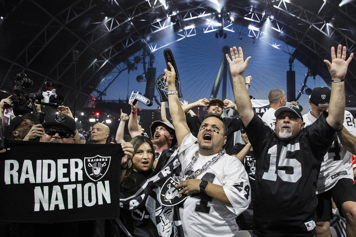 Raiders fans erupt after Las Vegas made their first pick of the 2022 NFL draft on Friday, April ...