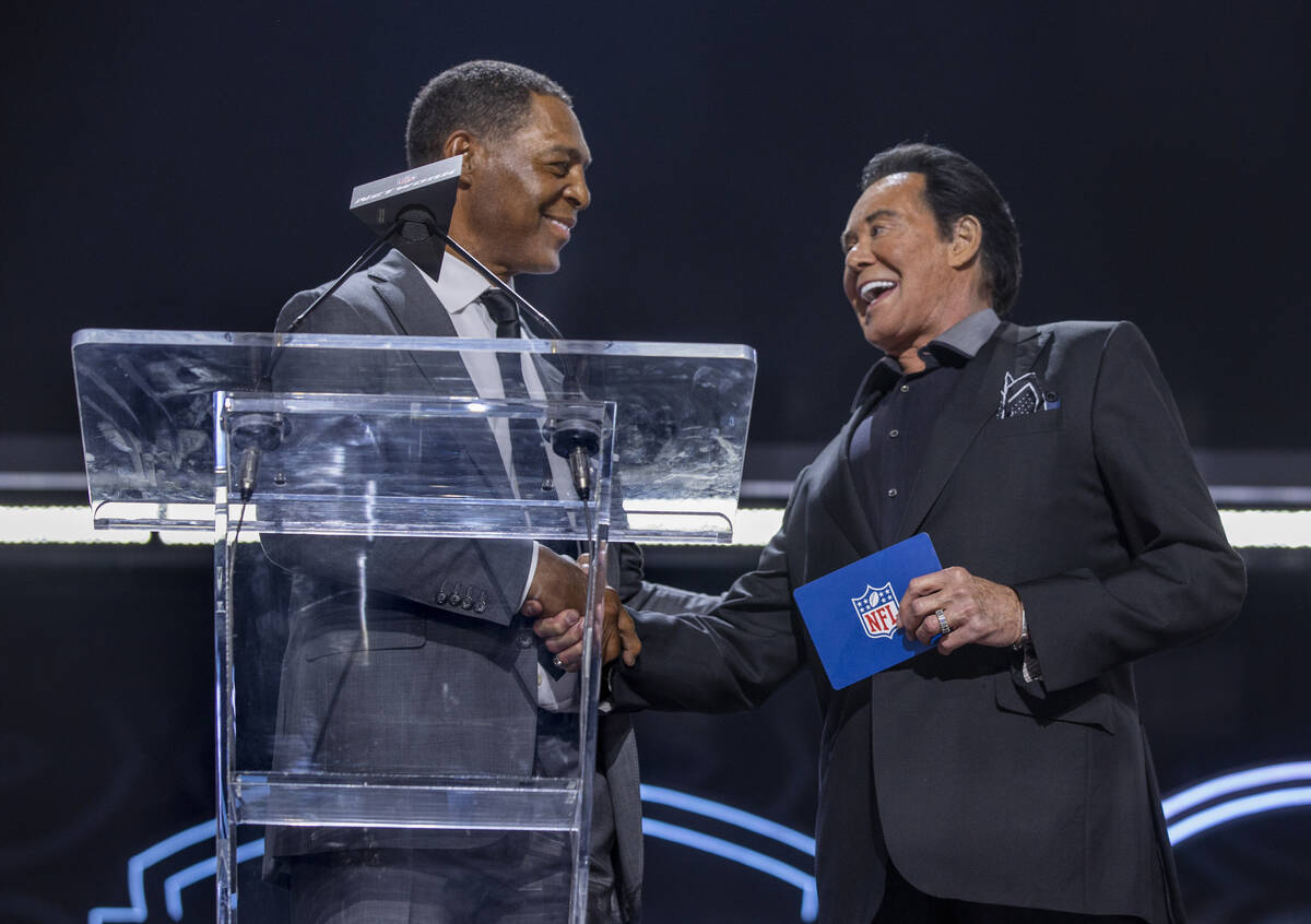 Marcus Allen and Wayne Newton announce 90th player selection at the Draft Theater during the se ...