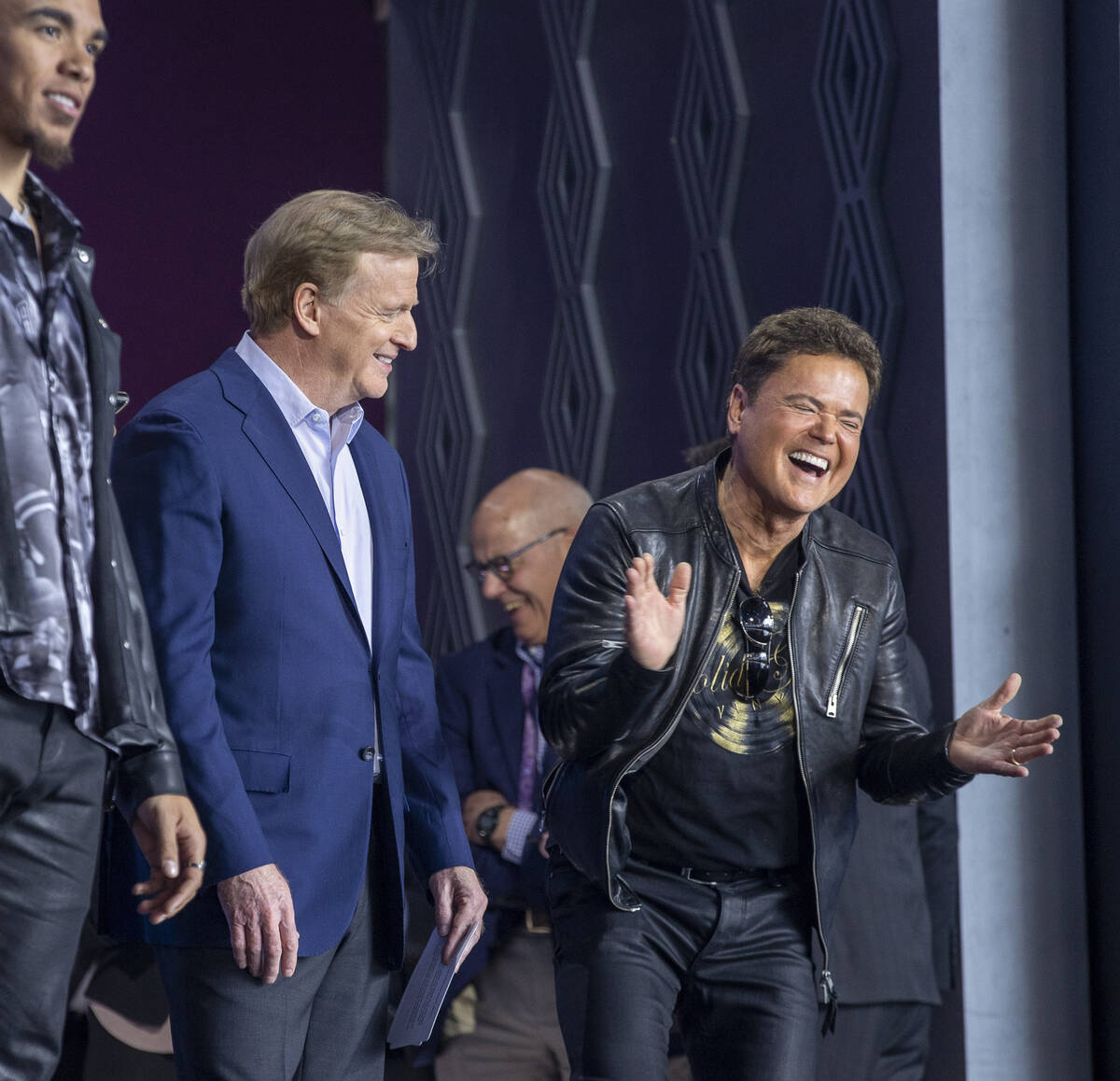 Commissioner of the National Football League Roger Goodell shares a laugh with Donny Osmond on ...