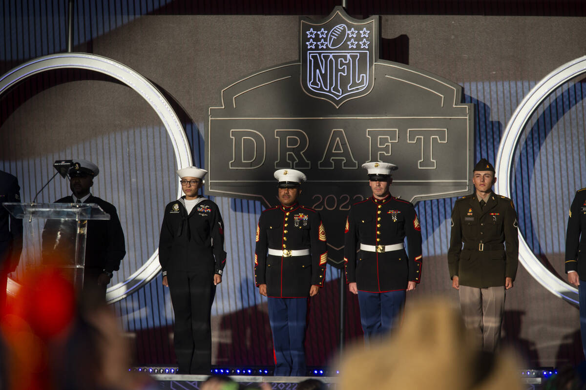 Members of the military take the stage during the second day of the NFL Draft event in Las Vega ...