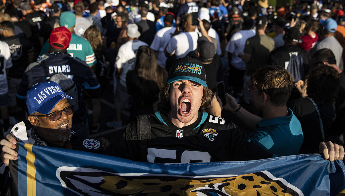Hayden Coddington, from Jacksonville, Fla., cheers for the Jaguars during day two of the NFL dr ...