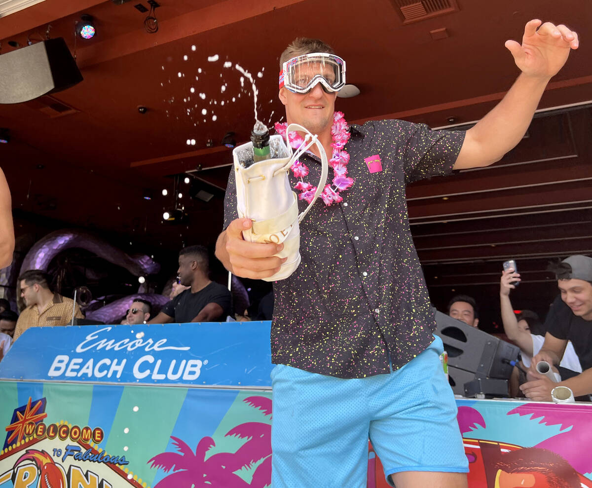 Rob Gronkowski sprays sparkling wine on the crowd during Gronk Beach party at Encore Beach Club ...