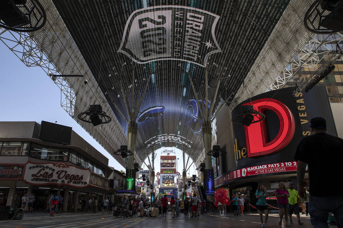 NFL football draft-related messaging is featured on the screen at Fremont Street Experience on ...