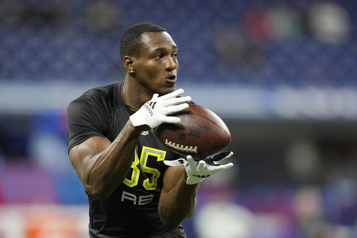 Georgia running back Zamir White runs a drill during the NFL football scouting combine, Friday, ...