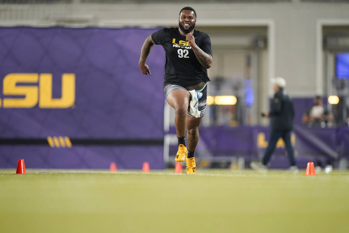 LSU defensive tackle Neil Farrell Jr. runs through drills during LSU Pro Day in Baton Rouge, La ...