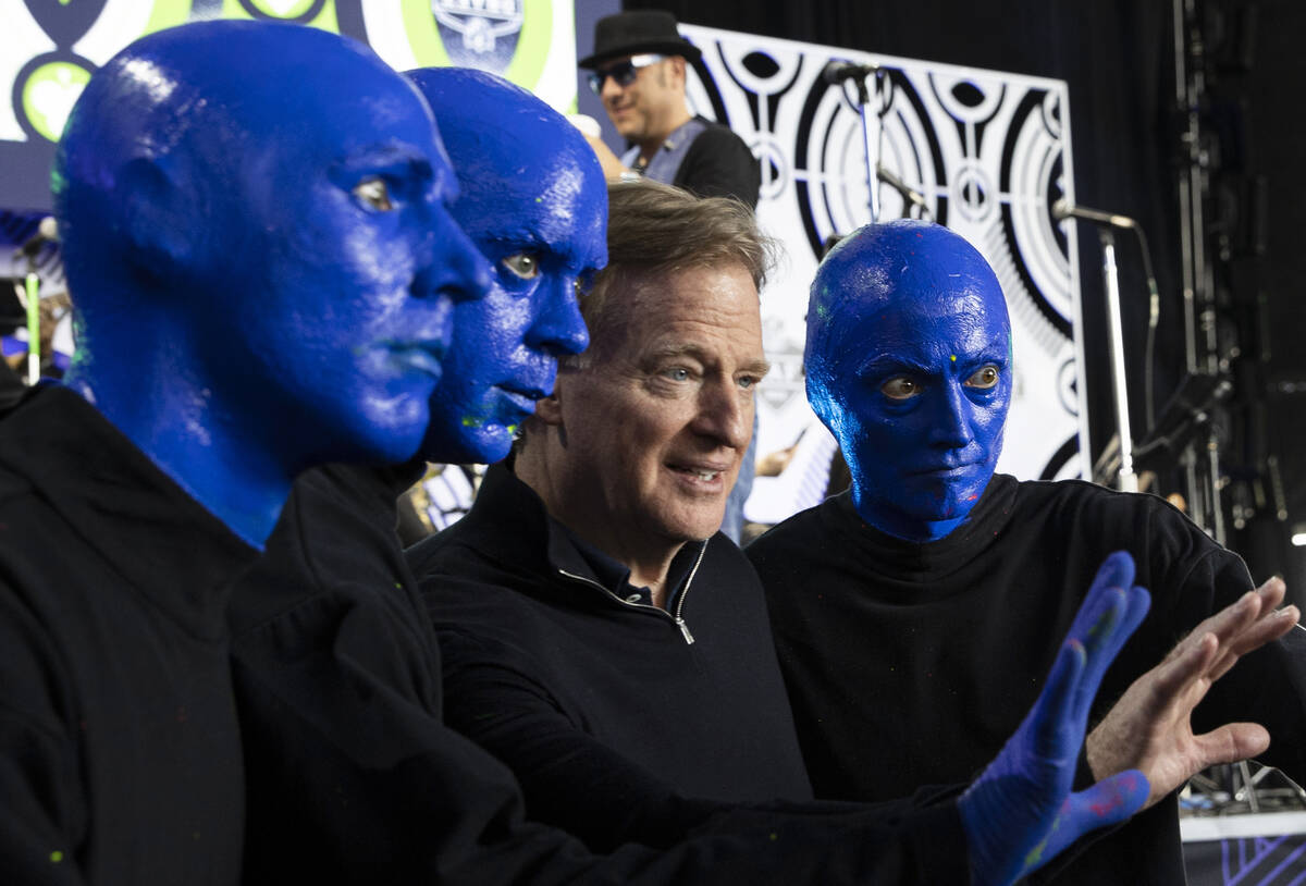 NFL commissioner Roger Goodell, third from right, poses for a photo with members of the Blue Ma ...