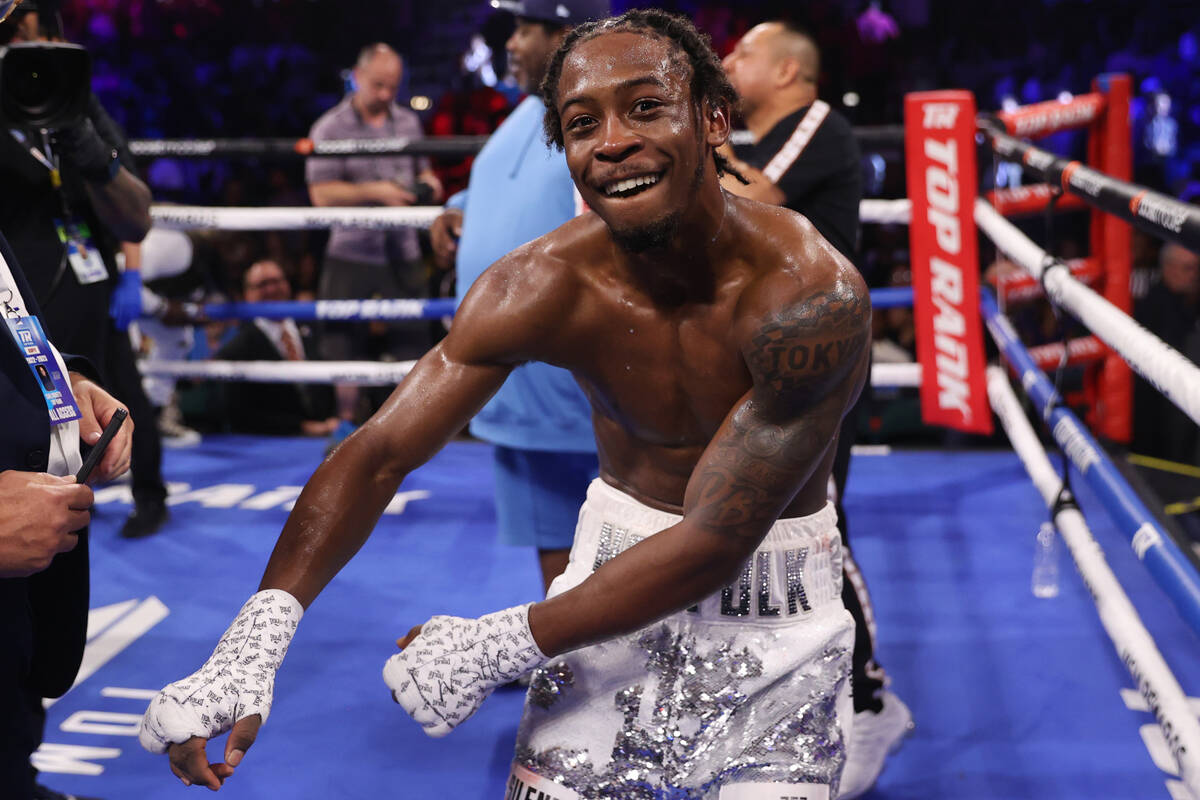 Keyshawn Davis celebrates his sixth round technical knockout win against Esteban Sanchez in a l ...