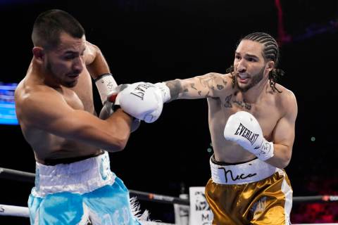 Nico Ali Walsh hits Alejandro Ibarra during their middleweight boxing match Saturday, April 30, ...