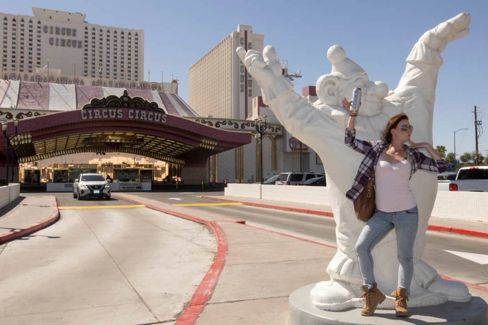 A passerby, who did not want to share her name, poses in front of Circus Circus on Sunday, June ...
