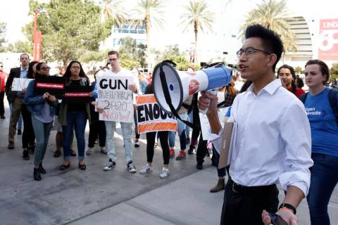 Karl Catarata, right, shouts slogans as UNLV students prepare to march on campus in Las Vegas o ...