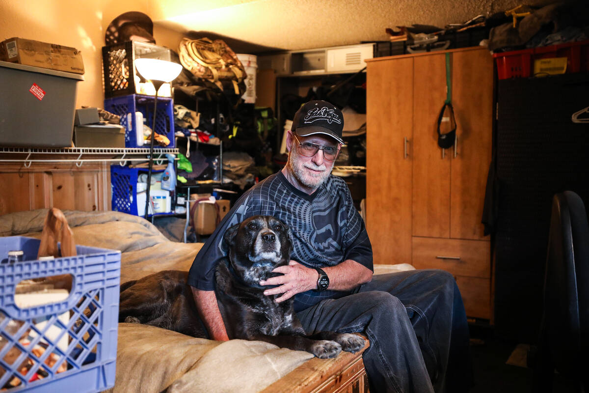 Veteran tenant Roderick Garrison with his dog at his apartment at Hebron, formerly known as Sha ...