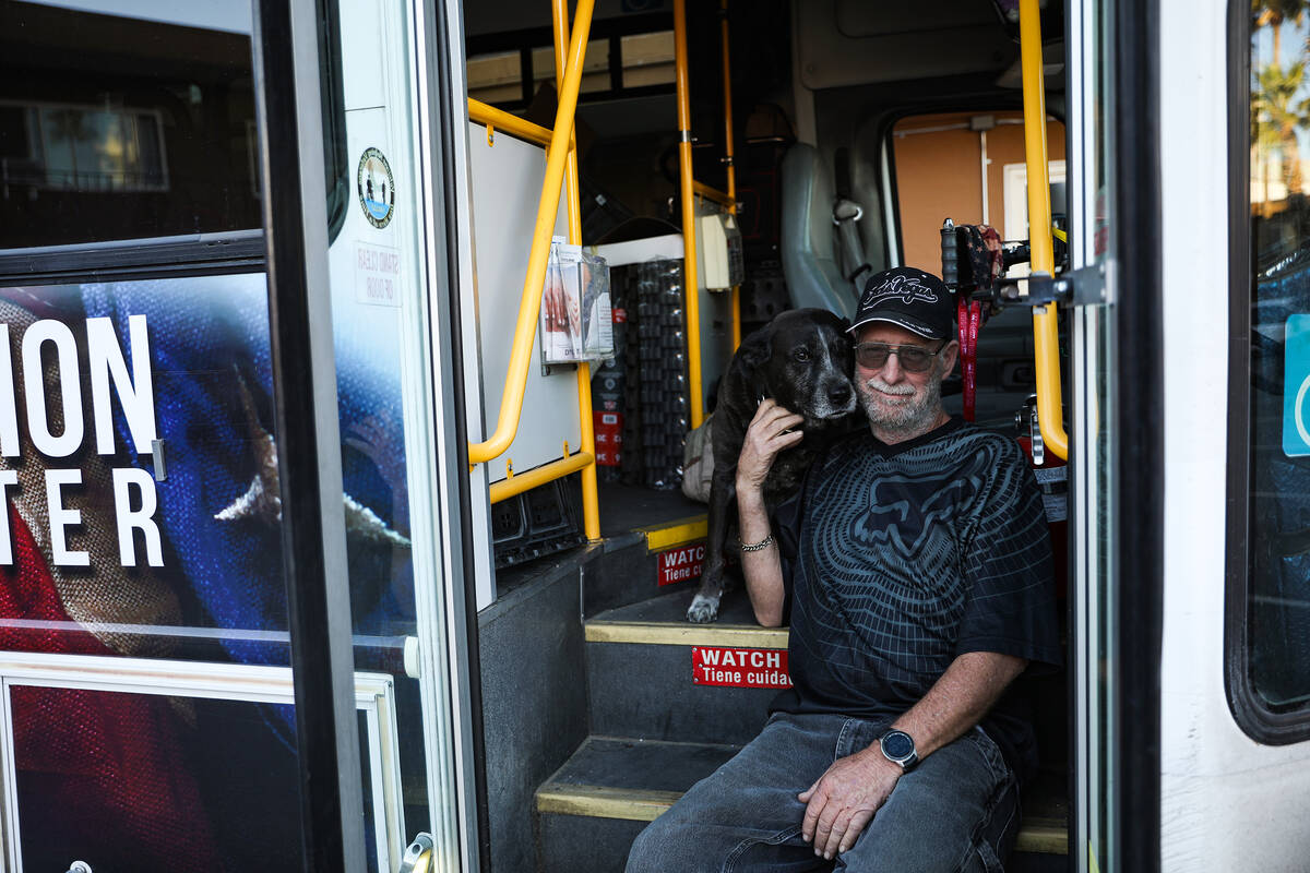 Veteran tenant Roderick Garrison with his dog at Hebron, formerly known as Share Village 1, in ...