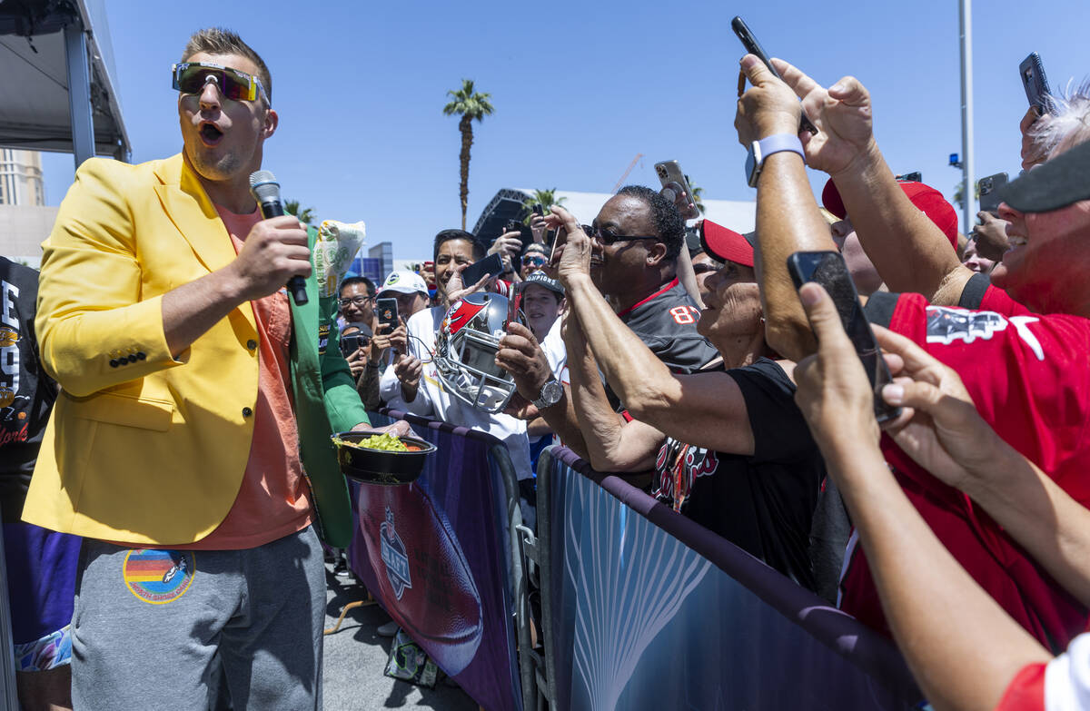 Tampa Bay Buccaneer Rob Gronkowski shows off a nicely prepared salad bowl to fans during a comp ...